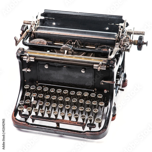 Old rusty and dusty typewriter on white background