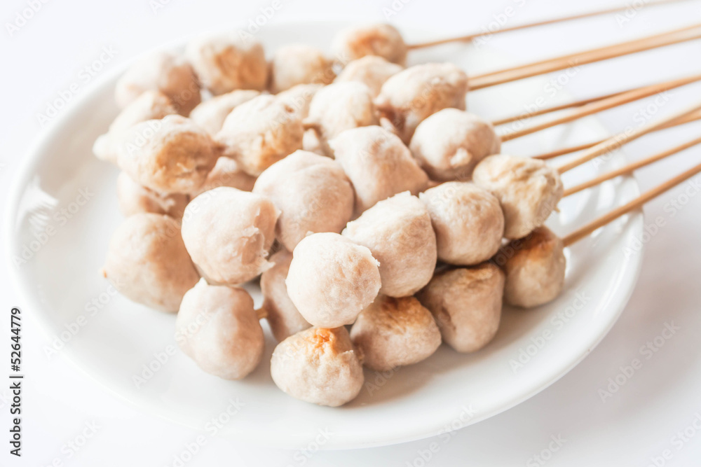 Mini pork balls in white plate on clean table Mini pork balls in white plate on clean table