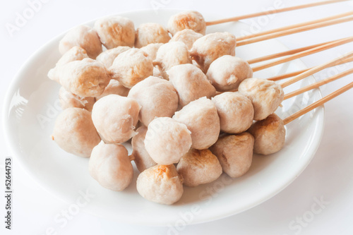 Mini pork balls in white plate on clean table