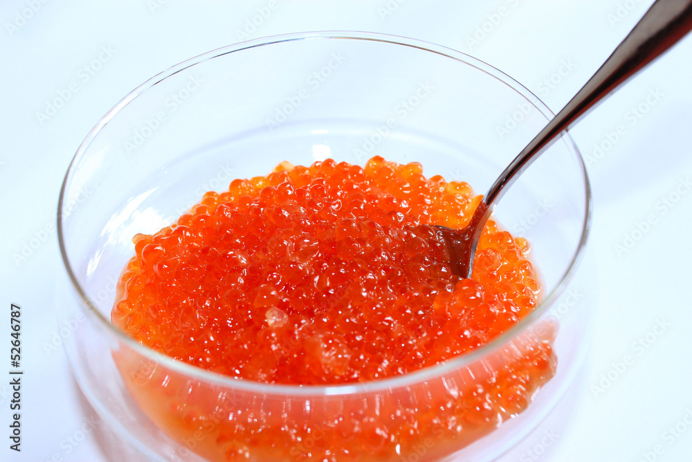 red caviar in a plate with the spoon red caviar in a plate with the spoon