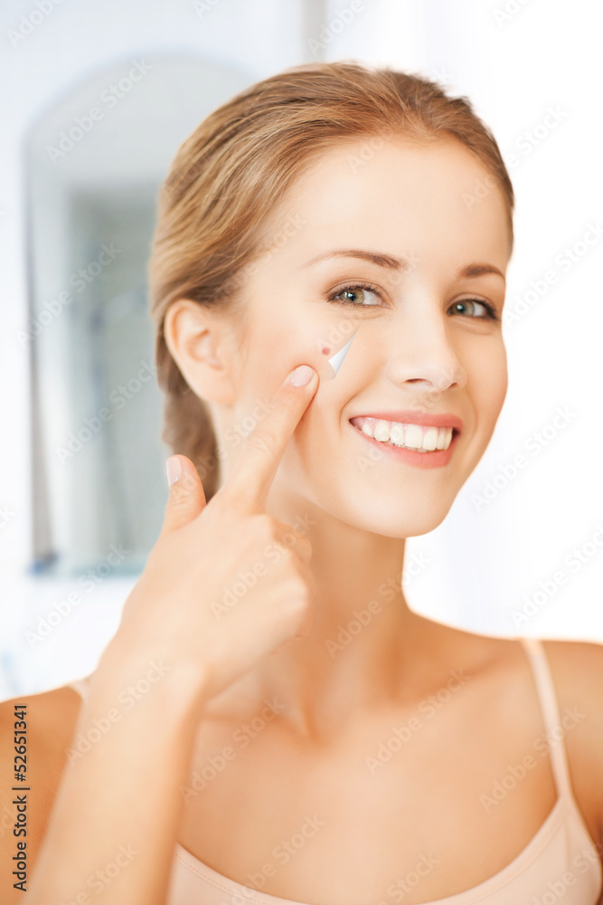 beautiful woman pointing to nose beautiful woman pointing to nose