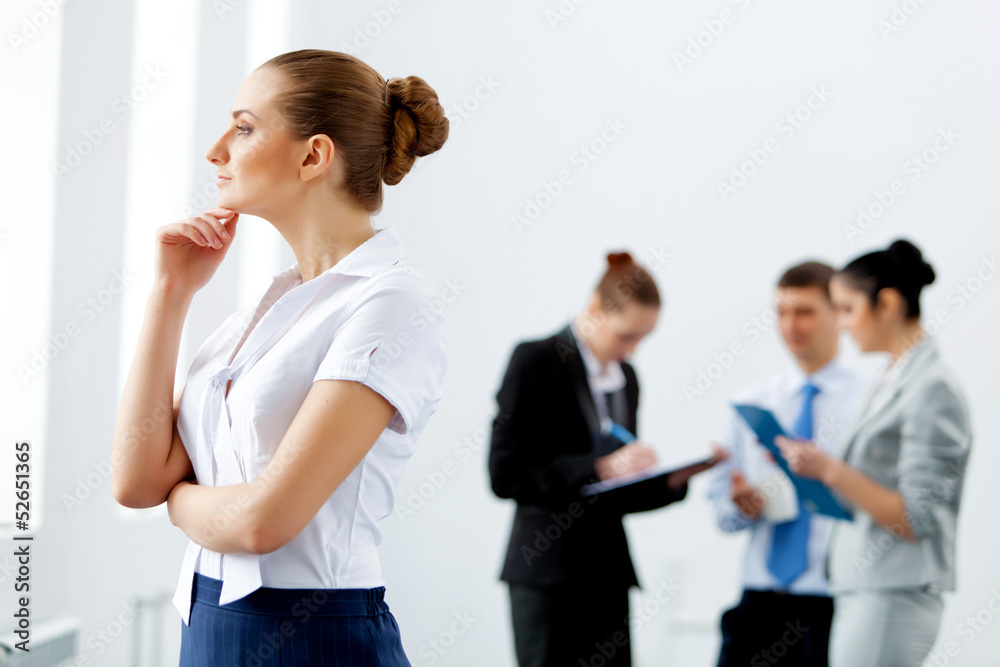 Four businesswomen standing in row Four businesswomen standing in row