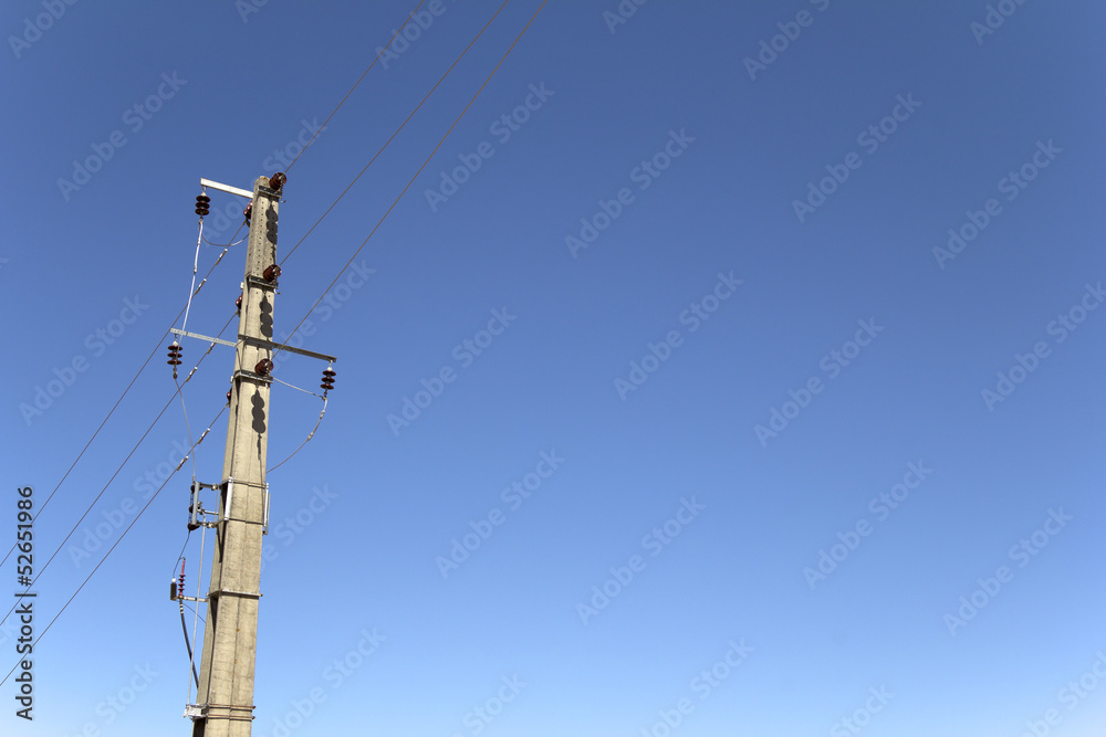 Electricity concrete pylons against clear blue sky Electricity concrete pylons against clear blue sky