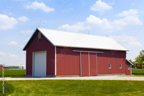 Red Barn With White Garage Door
