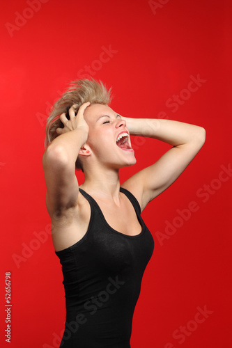 Fashion woman shouting with her hands on the head