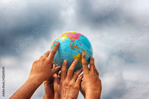 hand holding globe