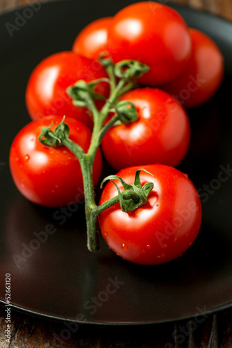 Tomatoes on plate angled view