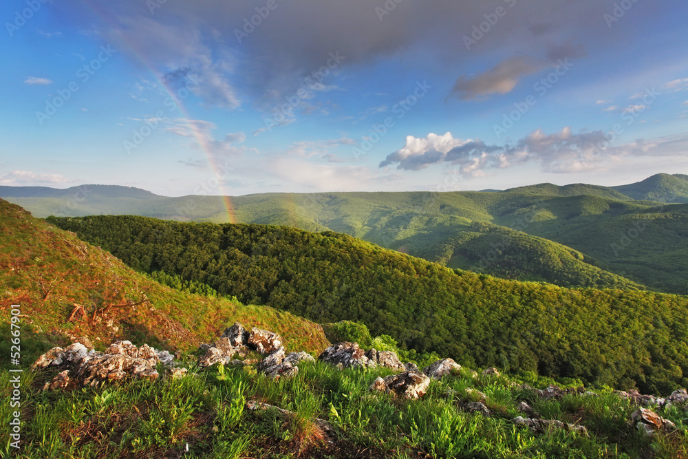 Rainbow in green mountain