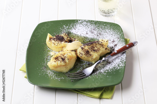 Bild auf Leinwand Lumps of potato puree with poppyseed and sugar