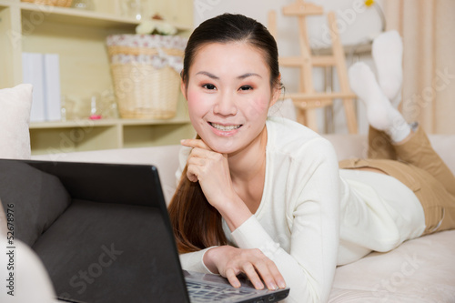 young asian woman using a laptop