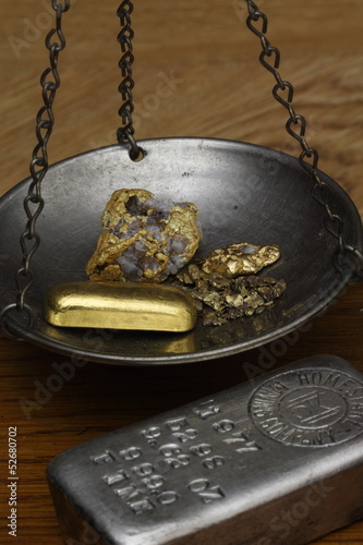 Gold Nuggets & Gold Bar on Balance Scale - Silver Ingot Beside