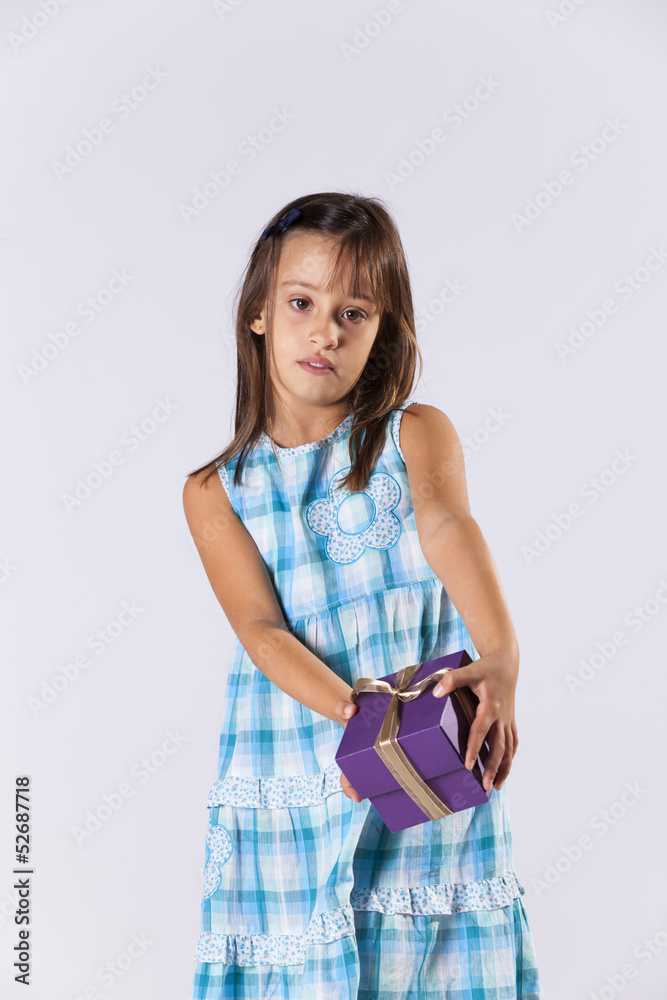 Little girl with a christmas present Little girl with a christmas present