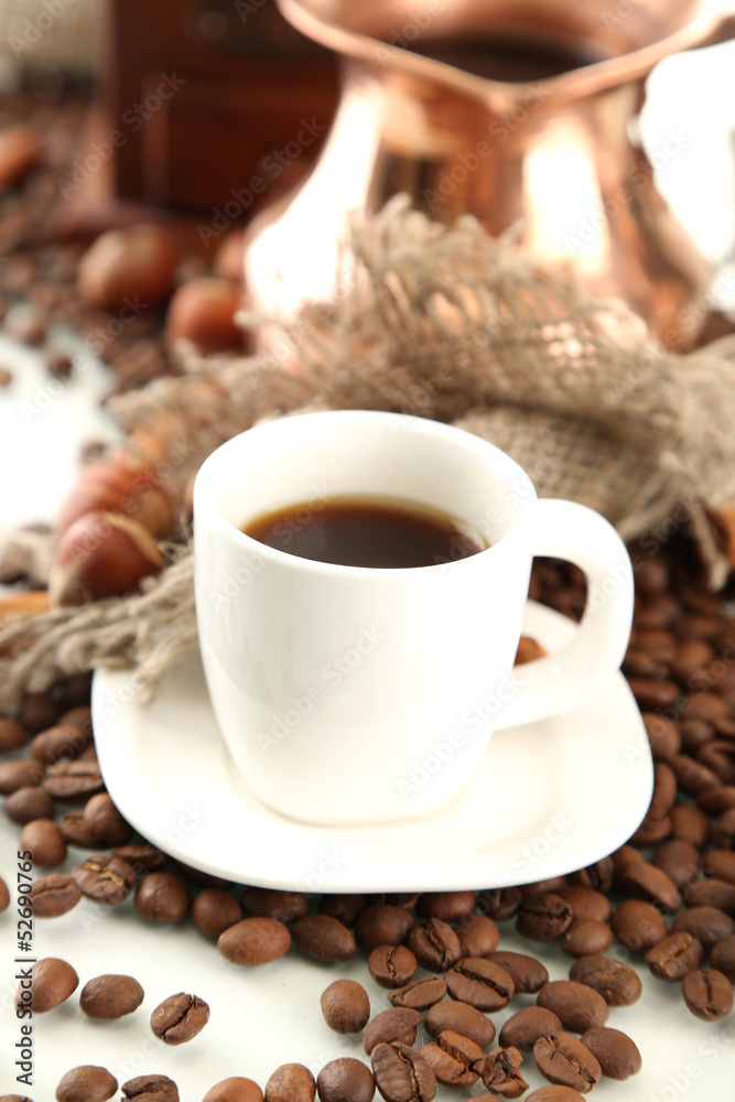 Cup and pot of coffee and coffee beans, isolated on white Cup and pot of coffee and coffee beans, isolated on white