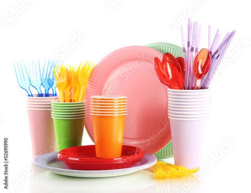 Multicolored plastic tableware isolated on white