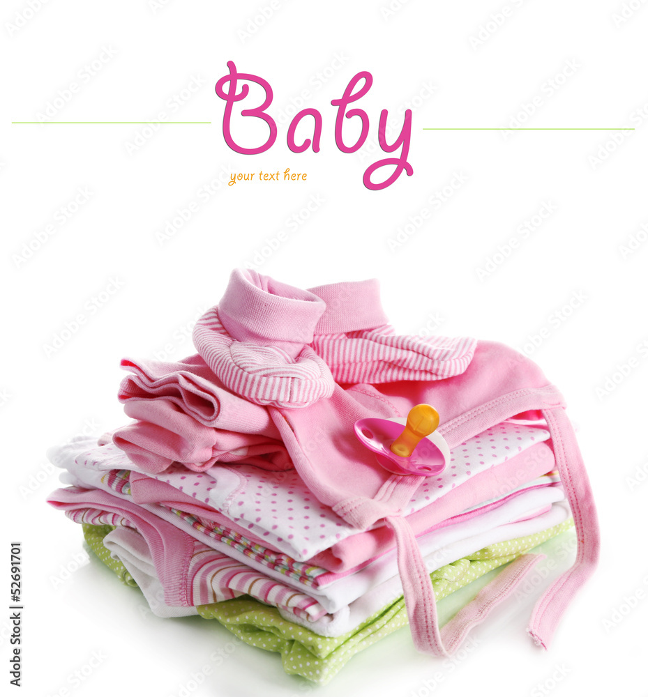 Pile of baby clothes isolated on white Pile of baby clothes isolated on white