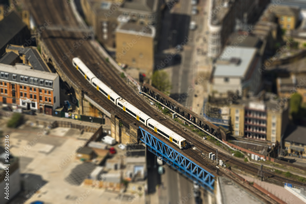Fototapeta premium Train on a bridge in London, tilt-shift effect