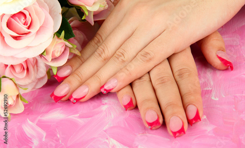 Closeup of hands of young woman with elegance manicure 