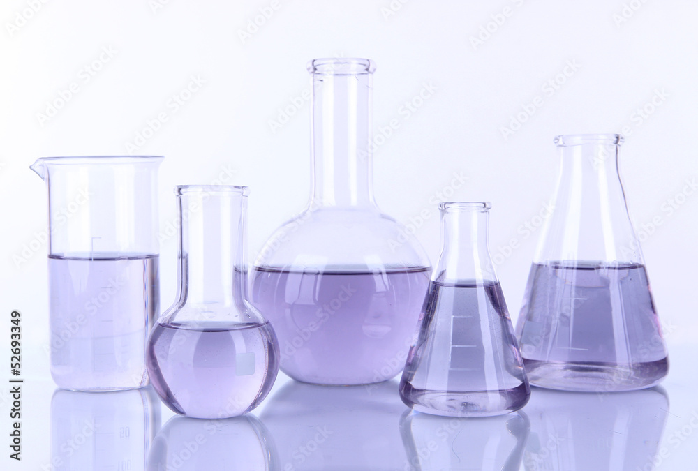 Test-tubes with light purple liquid isolated on white Test-tubes with light purple liquid isolated on white