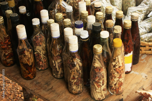 Display of bottles with "Mama Juana" in small village, Samana Pe