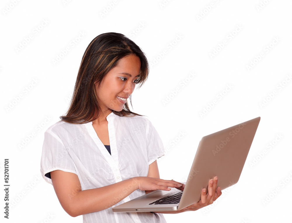 Charming young woman working on laptop computer Charming young woman working on laptop computer