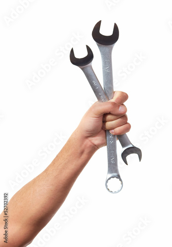Hand of auto mechanic with wrench.