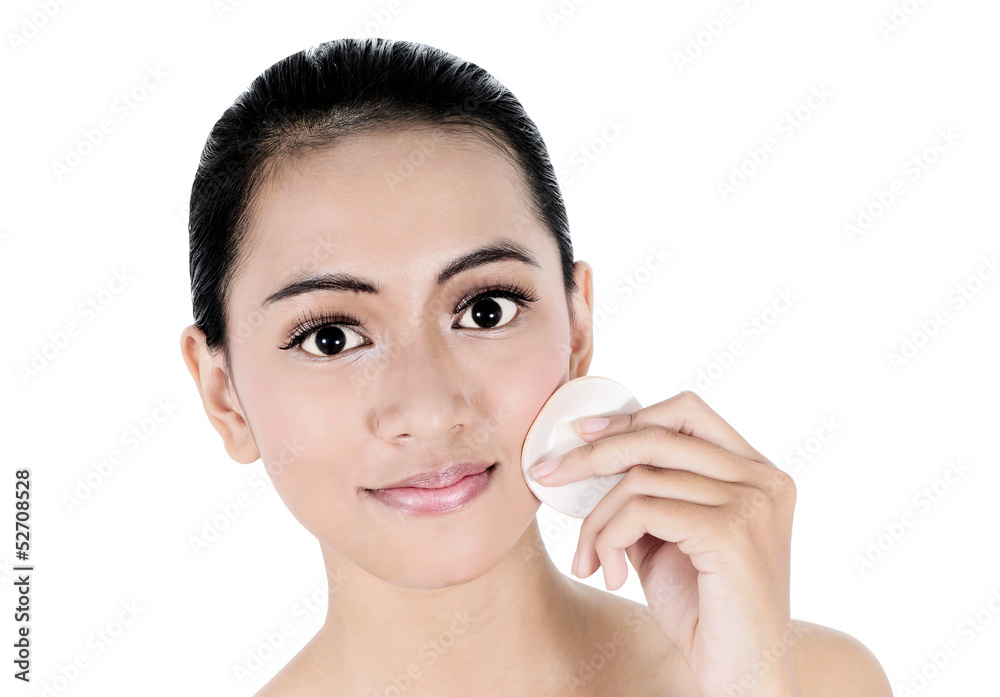beautiful woman using a powder on the cheeks, isolated on white