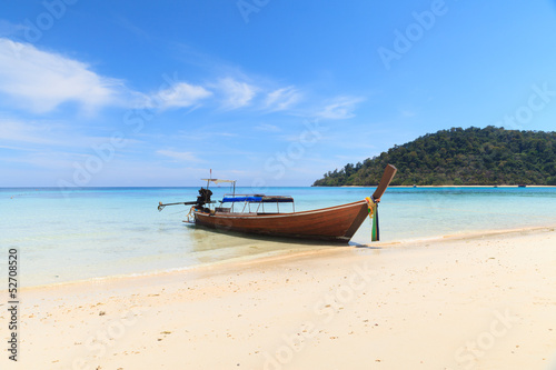 Boat on the beach with blue sky © PinkBlue