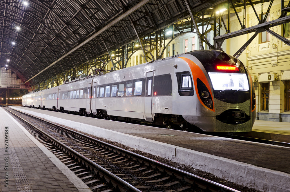High-speed train at the railway station High-speed train at the railway station