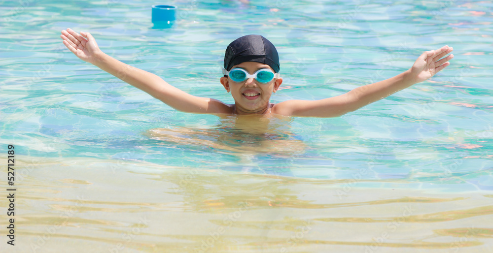 Boy is swimming in pool Boy is swimming in pool