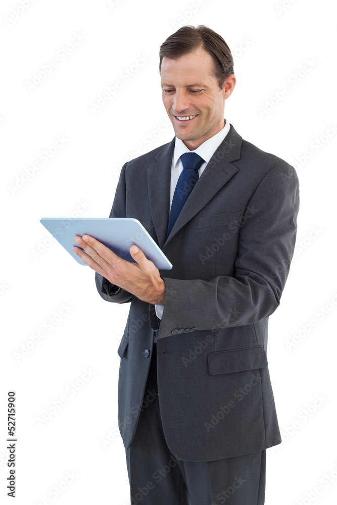 Smiling businessman holding a tablet pc Smiling businessman holding a tablet pc