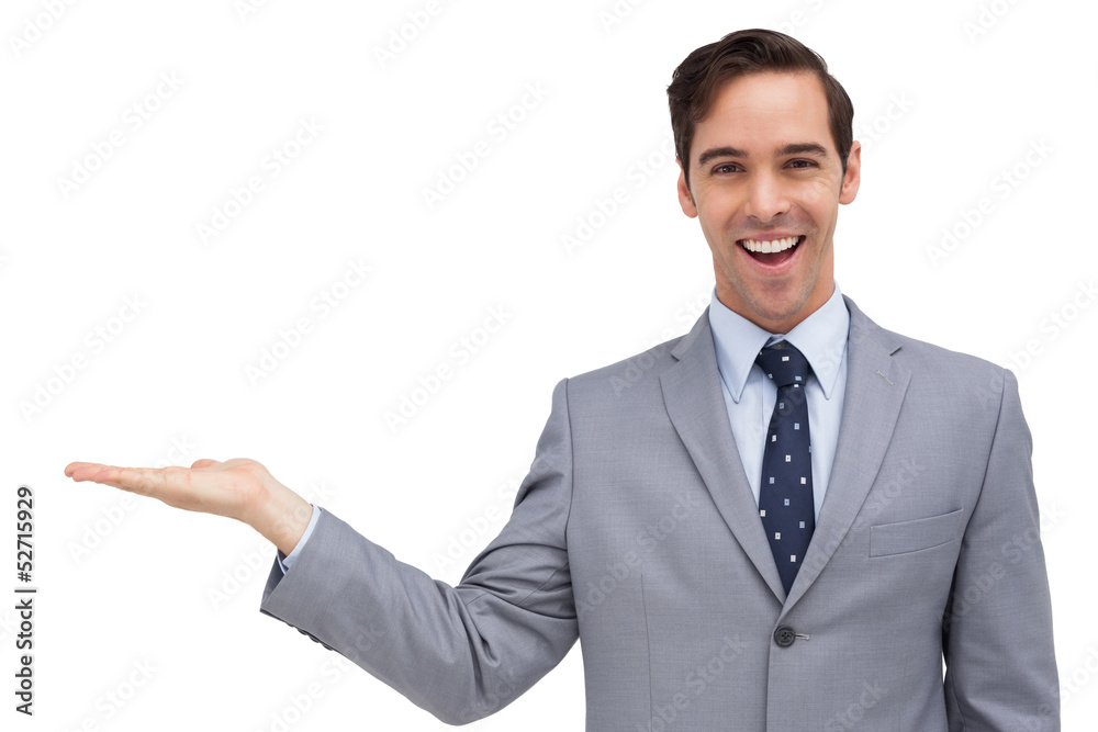 Young businessman with open hand looking at the camera Young businessman with open hand looking at the camera