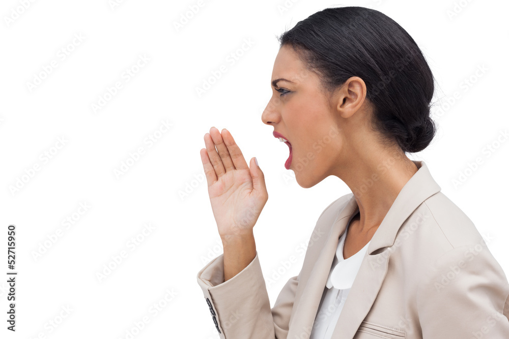 Profile view of a businesswoman calling for someone Profile view of a businesswoman calling for someone