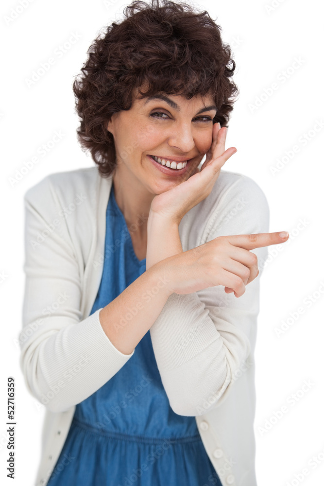 Smiling woman pointing something with her finger Smiling woman pointing something with her finger