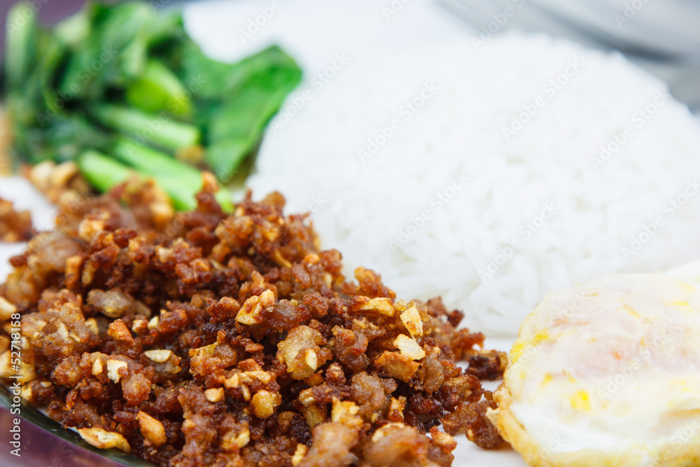 Plain rice deep fried pork with garlic and pepper. Plain rice deep fried pork with garlic and pepper.