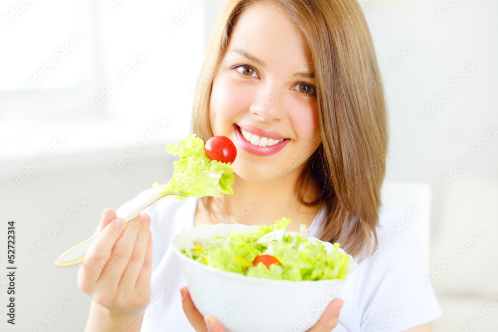 Teenager girl eating salad Teenager girl eating salad