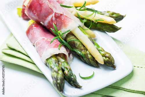 Green and white asparagus wrapped in prosciutto ham