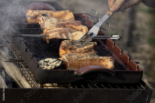 Preparation of meat on the BBQ photo