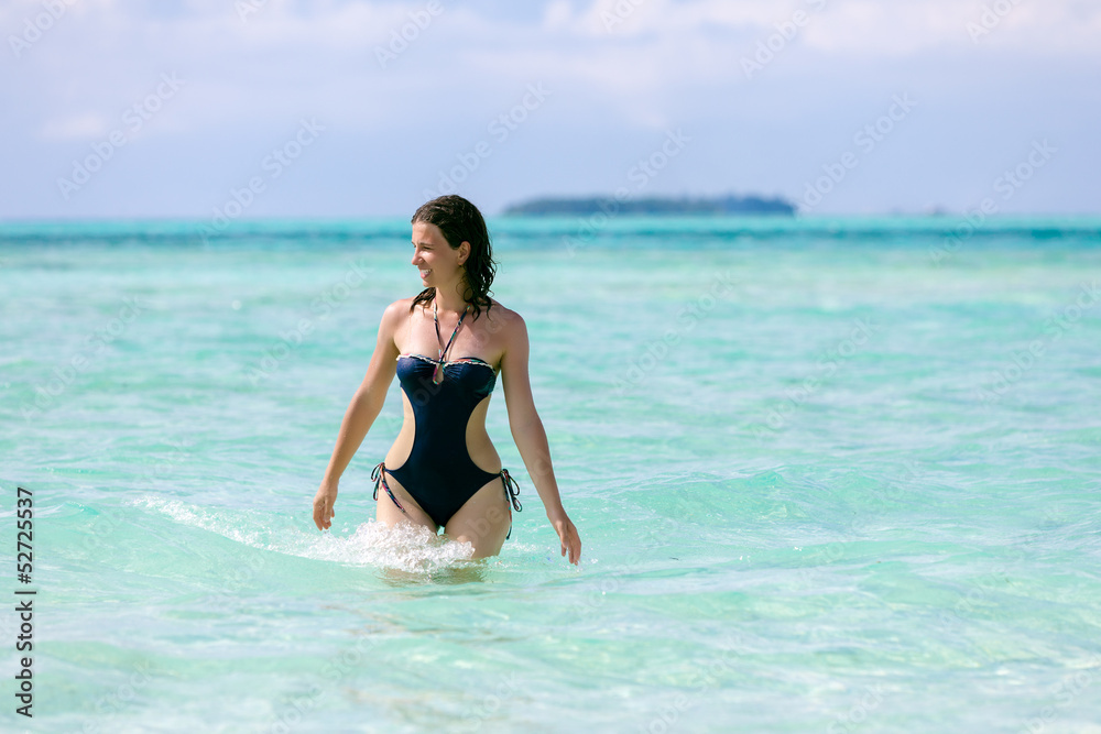 Caucasian woman rests at beautiful seashore Caucasian woman rests at beautiful seashore