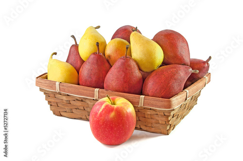 Yellow and vinous pears in the basket and apple isolated on whit