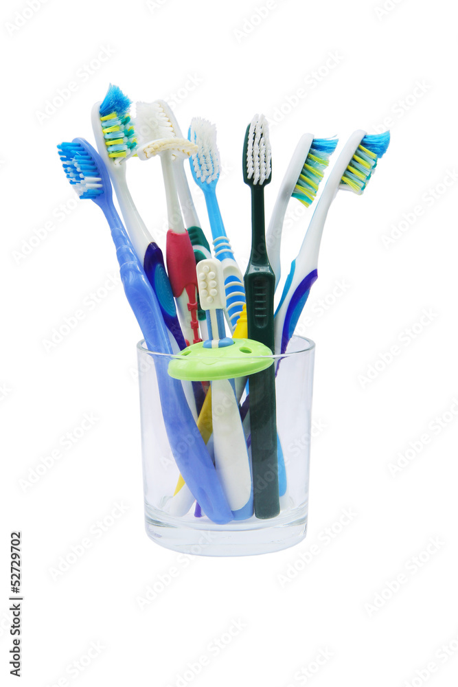 Toothbrushes in a glass isolated Toothbrushes in a glass isolated