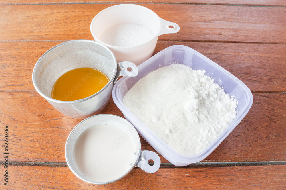 Set of baking ingredients flour, butter, sugar and milk Set of baking ingredients flour, butter, sugar and milk