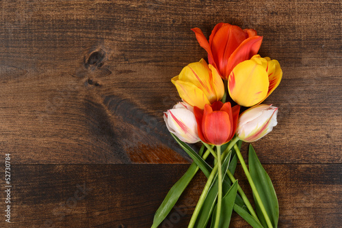 Fototapeta Naklejka Na Ścianę i Meble -  colorful tulips on wood