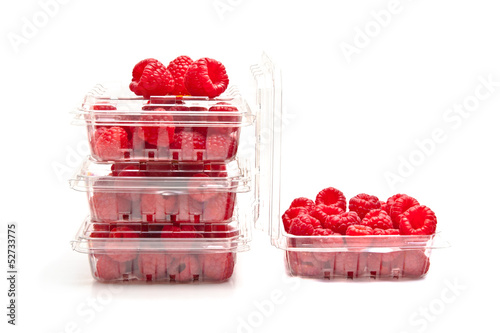 Red raspberries in plastic fruit containers