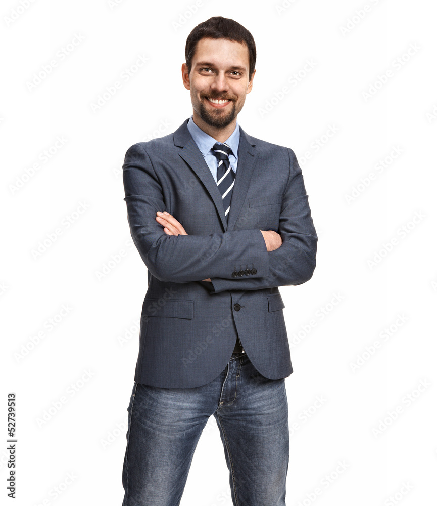 Friendly and smiling businessman with arms crossed