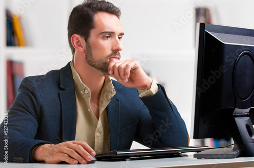 Man Looking At A Computer Monitor
