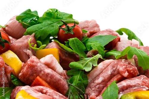 Fresh butcher cut and tomatoes meat assortment garnished
