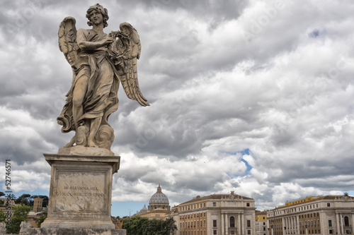Canvas Print A statue on rome bridge with vatican background