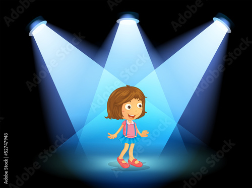 A girl smiling at the center of the stage