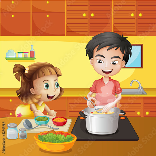 A young girl and boy at the kitchen