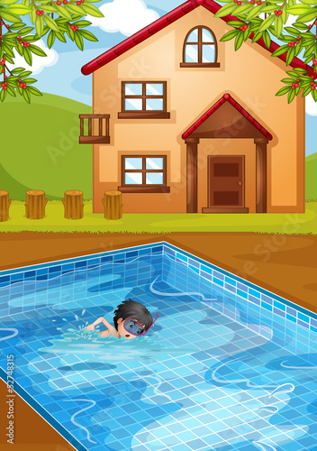 A kid swimming at the pool in the backyard